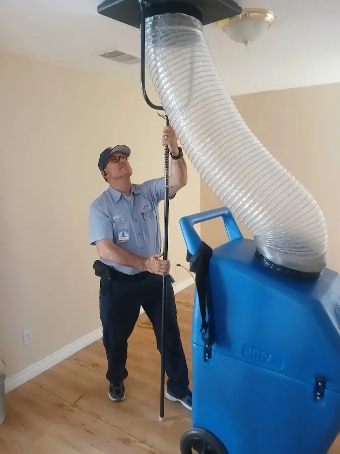 Furnace Tune-Up technician using HEPA equipment in Oxon Hill